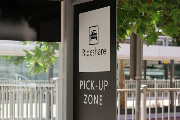 A rideshare pickup zone sign represents a Clemson rideshare accident lawyer case.