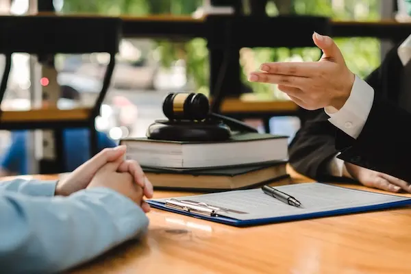 Motorcycle accident lawyer meeting with an injured client during a case consultation
