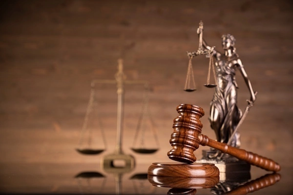 A gavel and scales of justice represent a pedestrian accident lawyer from Car Crash Lawyer SC.